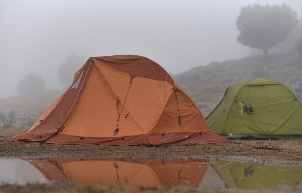 tents in mountains in rain